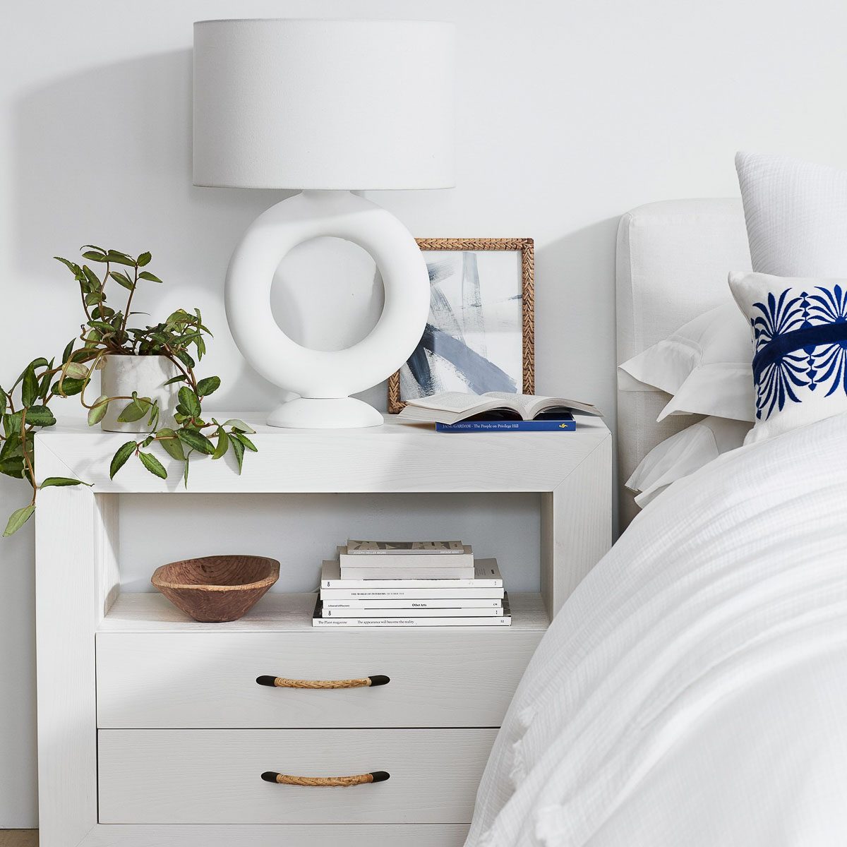 Potted plant as part of nightstand decor