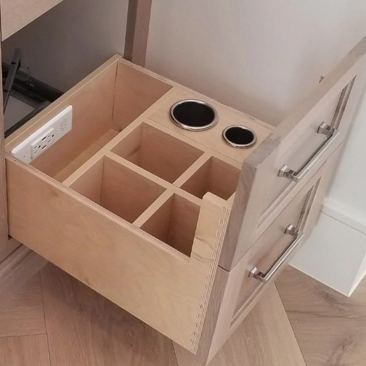 Outlet in vanity drawer for hair dryer and curling irons