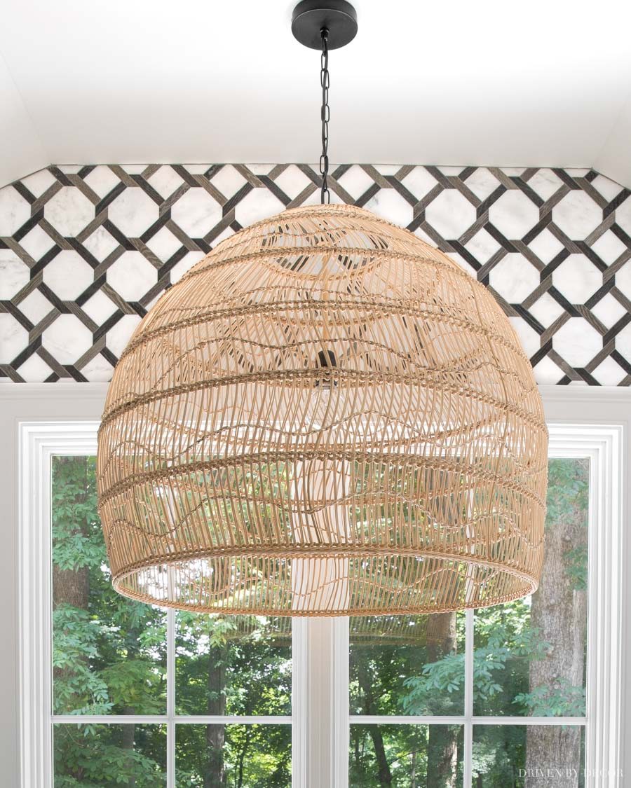 LOVE this large rattan pendant over the bathtub in her master bathroom!