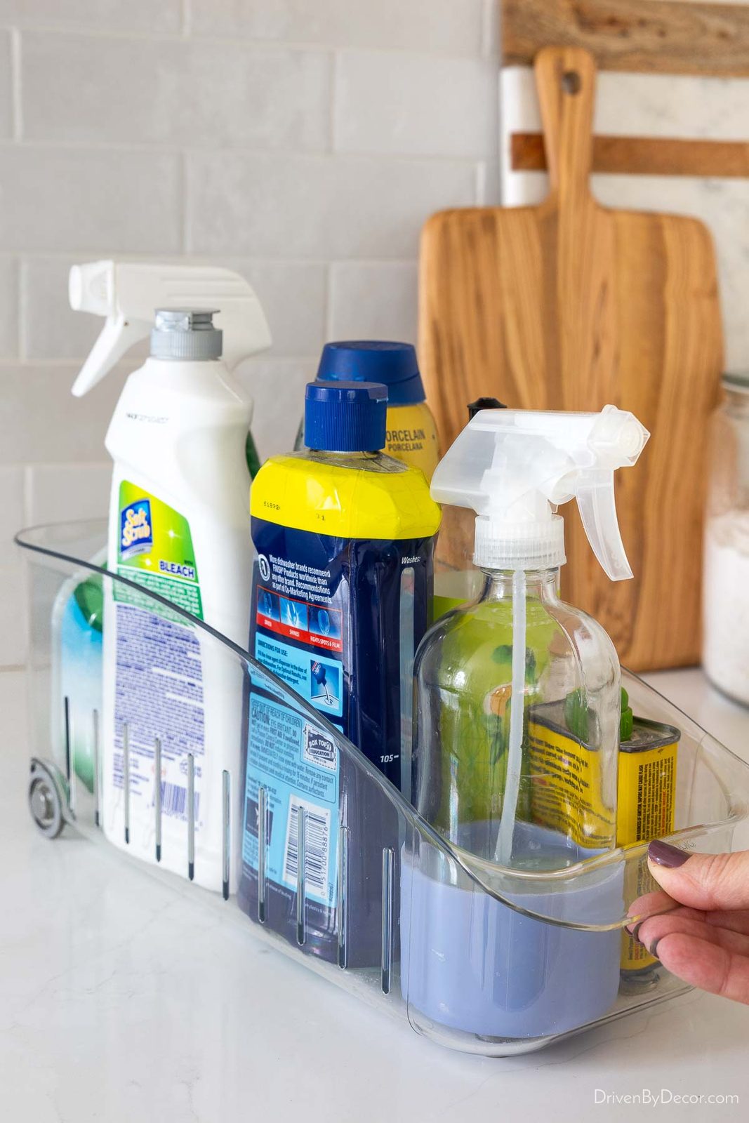 Rolling organizer holding cleaning supplies