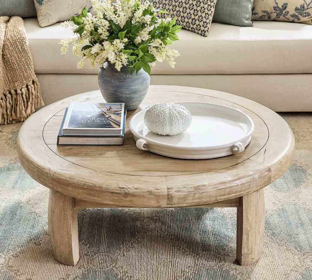 Faux greenery on a round coffee table
