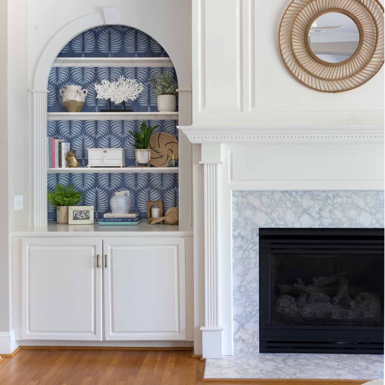 Love the look of a simple rattan mirror above the fireplace!