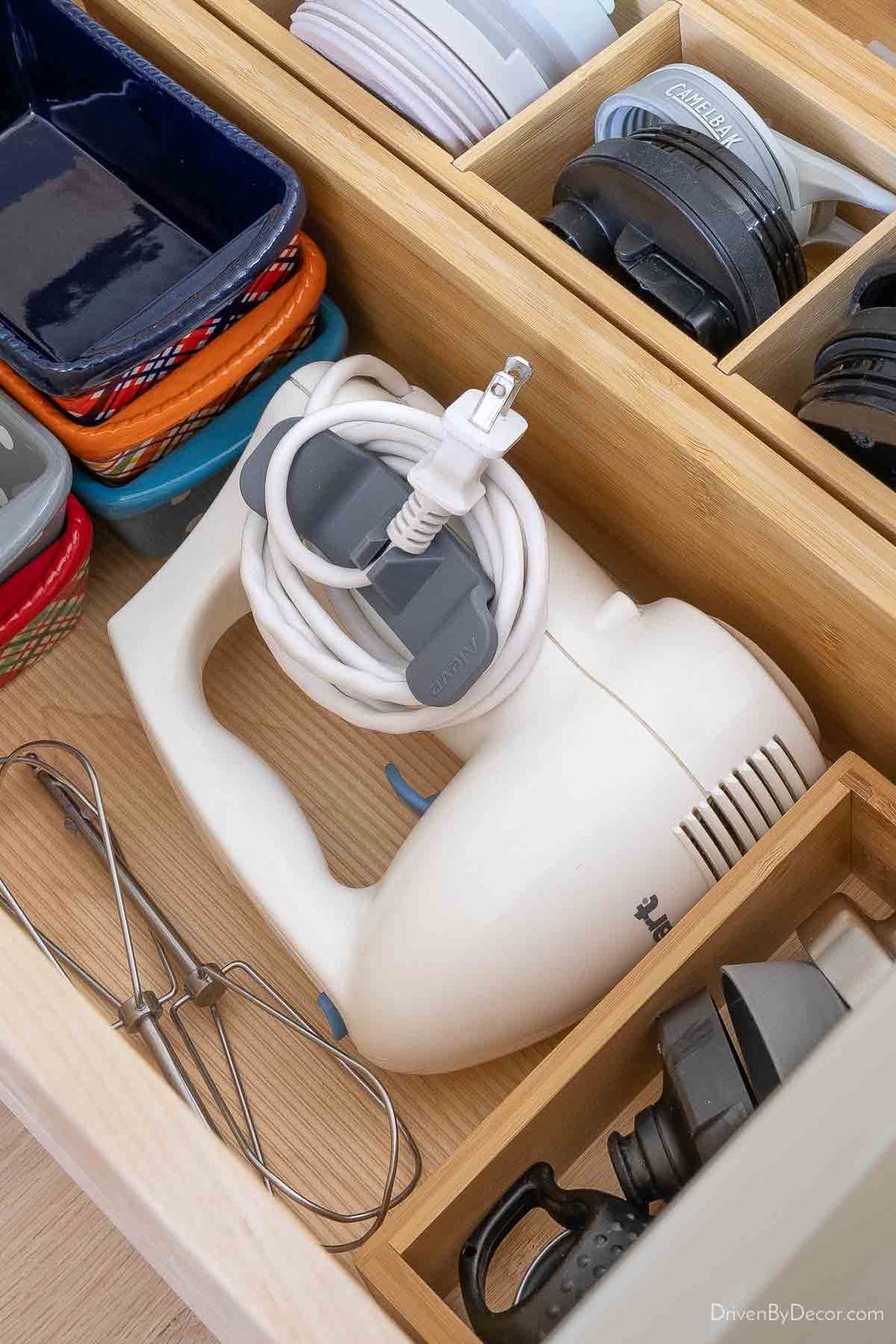 Cord organizer on handheld mixer