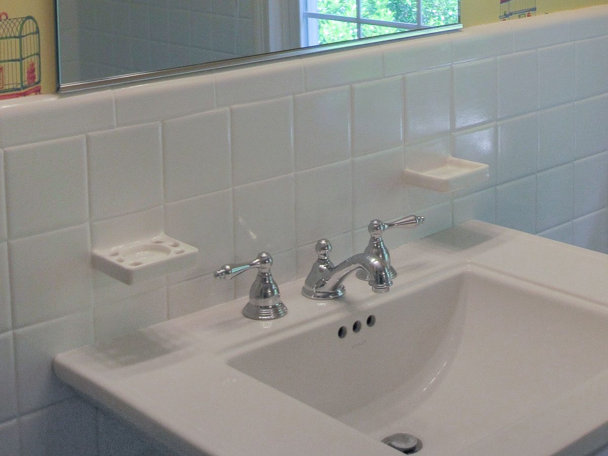 Toothbrush and soap holders integrated into tile