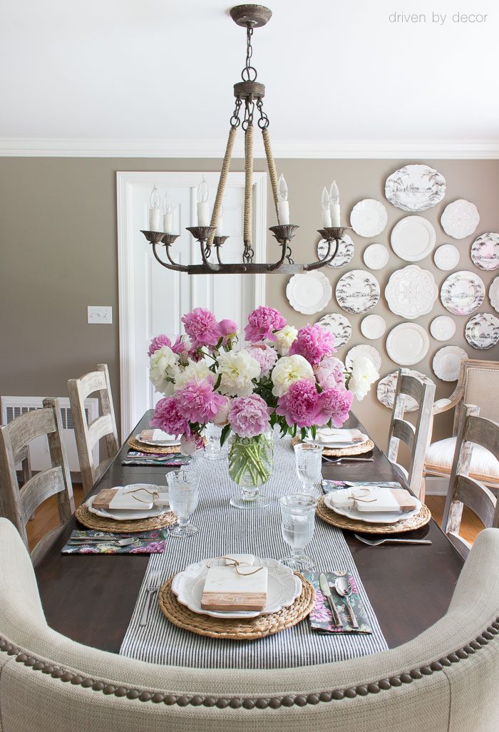 Summer entertaining with a simple pink and white tablescape - love the simple vase filled with peonies (and swooning over that rope chandelier!)