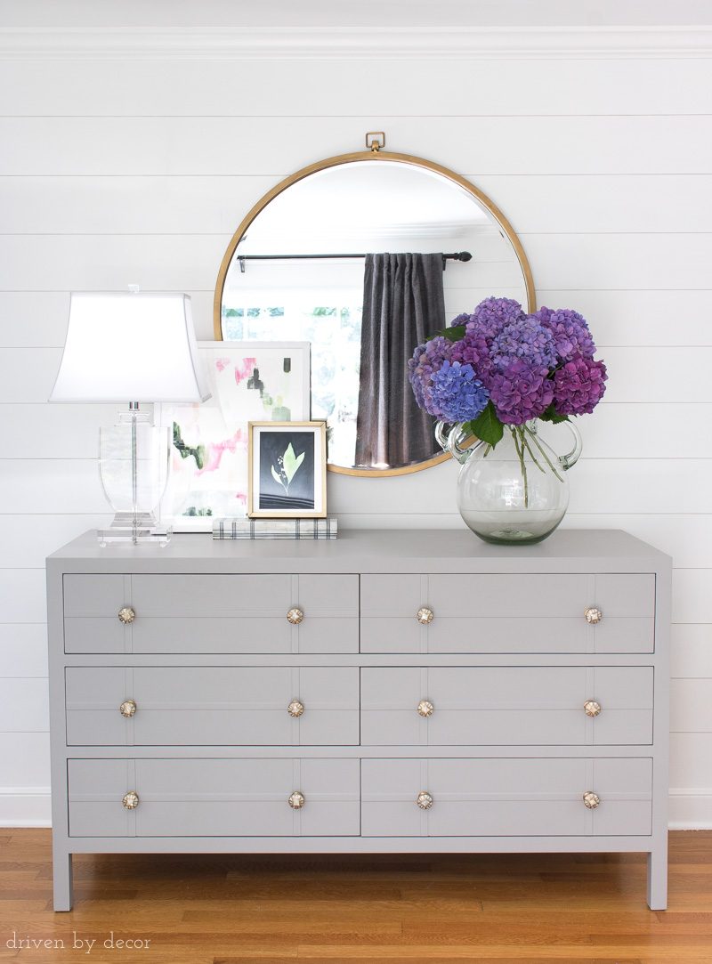 Purple hydrangeas in vase on bedroom dresser