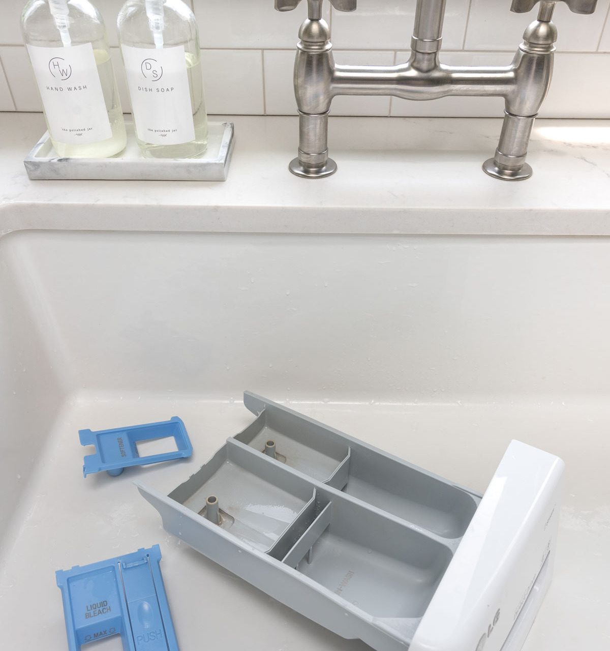Tips for cleaning your washing machine including the detergent dispenser