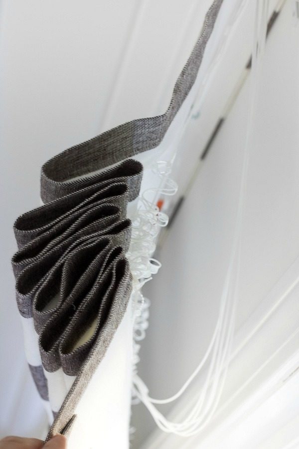 Tuck shade cords in behind the shade to hide them