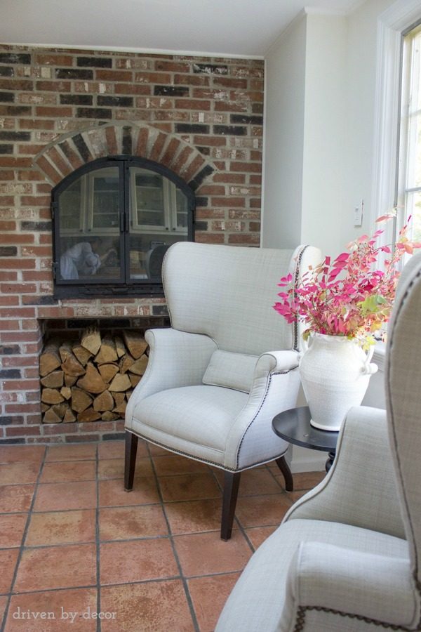 Two chair seating area next to kitchen fireplace