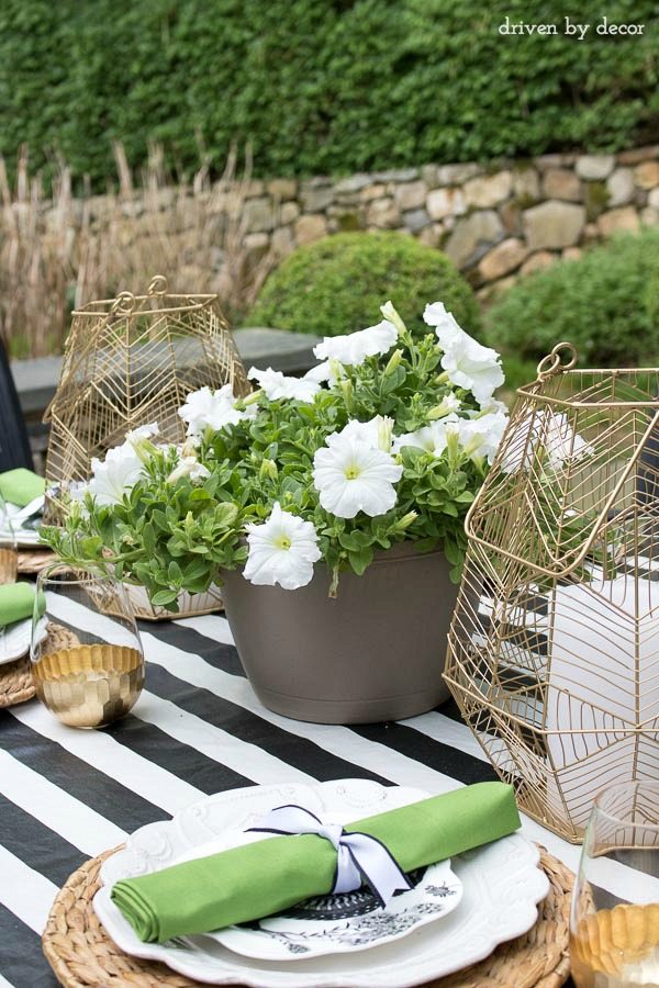 Use a hanging planter as a simple outdoor dining centerpiece! One of the tips for simplifying summer in this post!