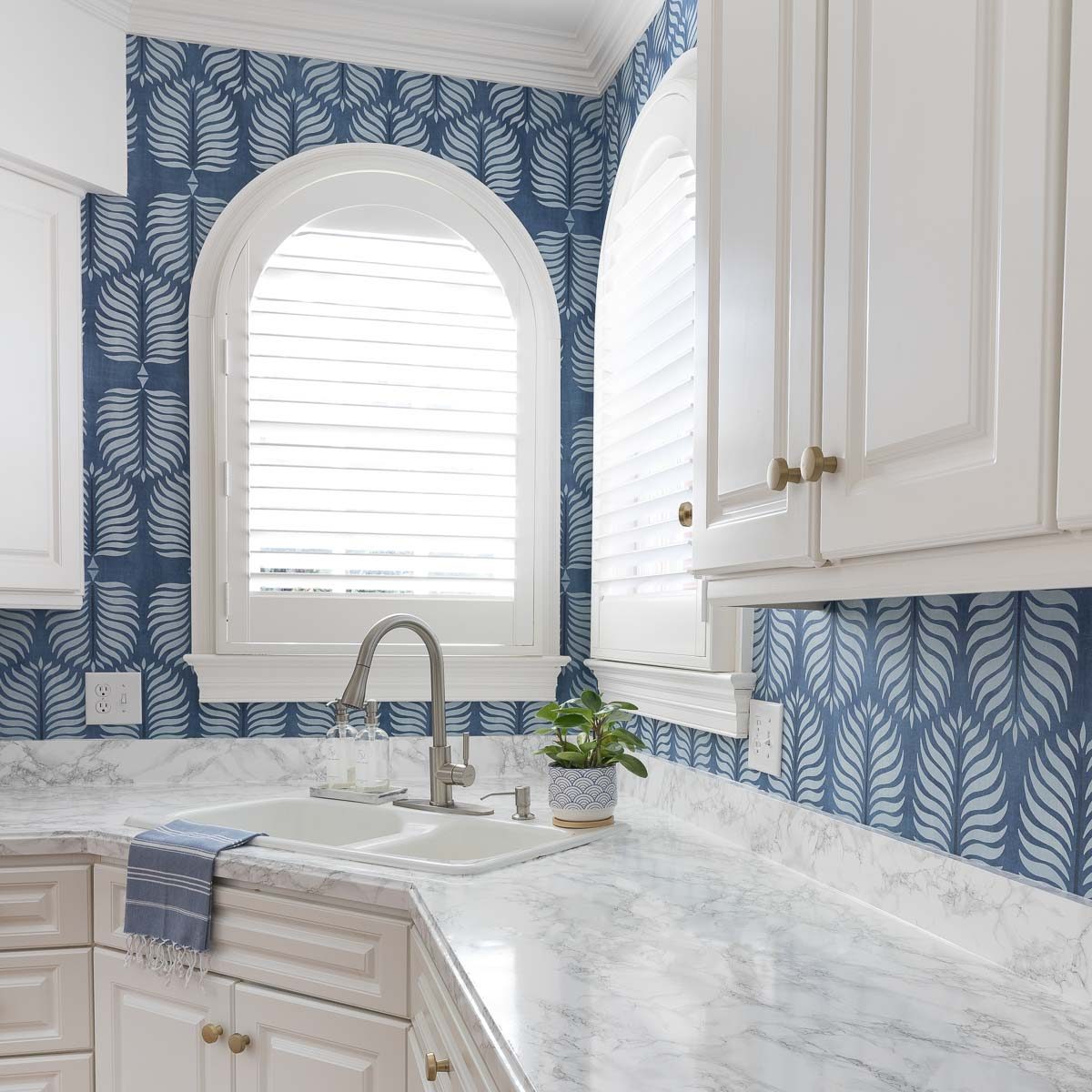 The wallpaper backsplash in our kitchen!