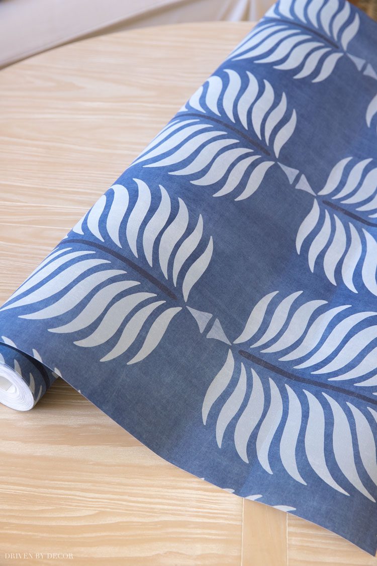 Love this wallpaper we added to the back of our bookcases!
