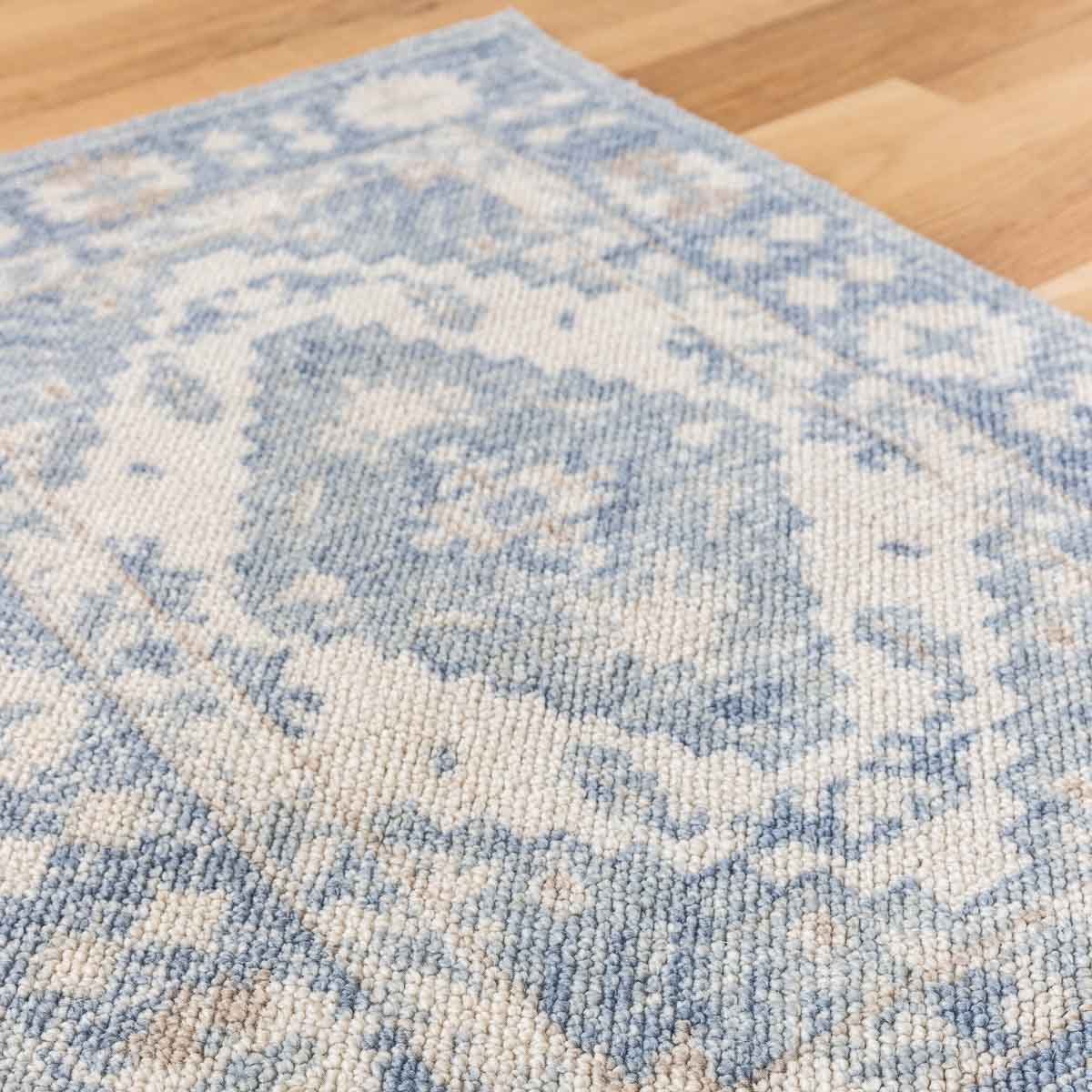 What size rug to buy for your living room (example of blue patterned rug)