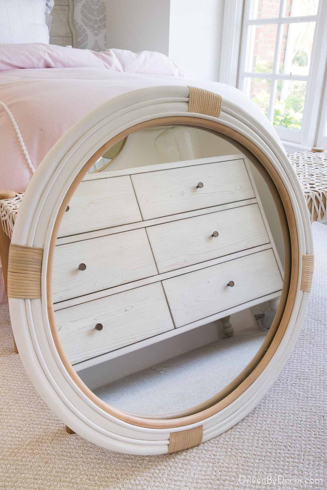 Round white rattan mirror for our hall bathroom