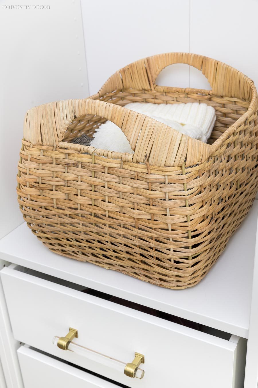 Pretty woven storage baskets for hats, scarves, and gloves in our coat closet.