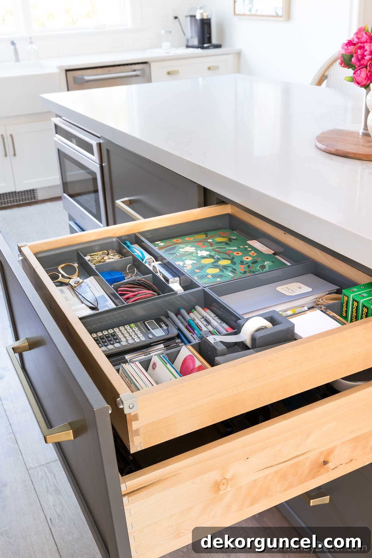 A roll out drawer in our kitchen island that we used for desk supplies, a smart kitchen remodel idea