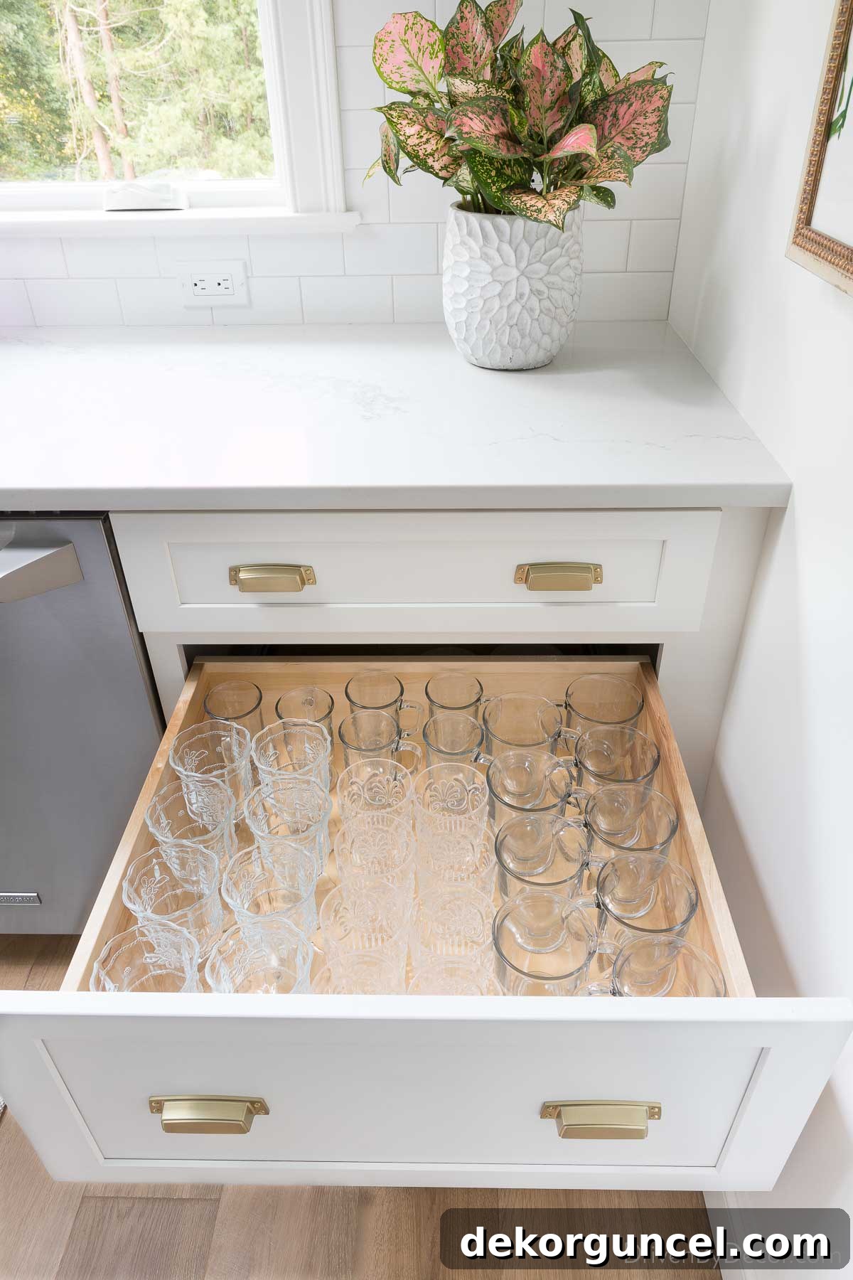 Kitchen drawer used for storing glasses, offering easy access and organization