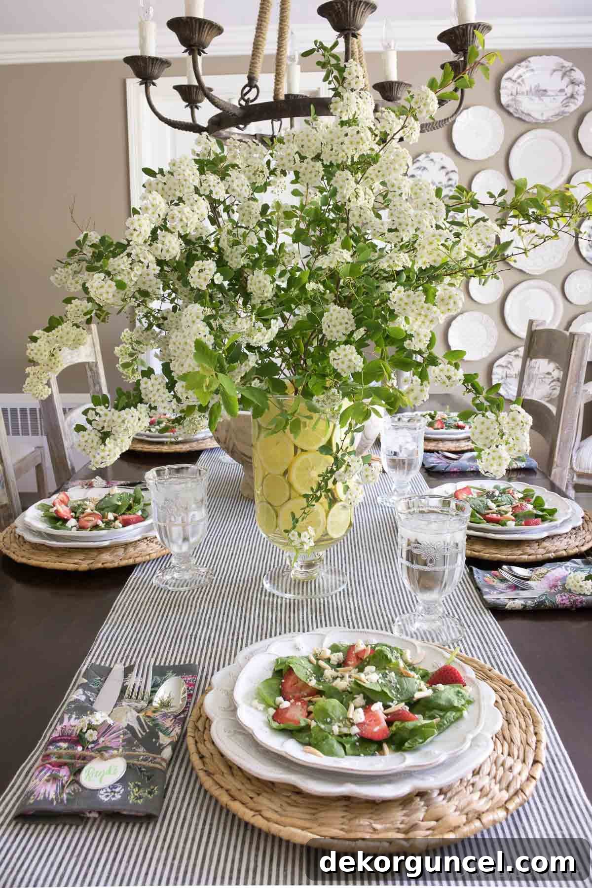 A charming close-up of a vase beautifully lined with fresh lemon slices, making for a refreshing and eye-catching Easter table decoration.