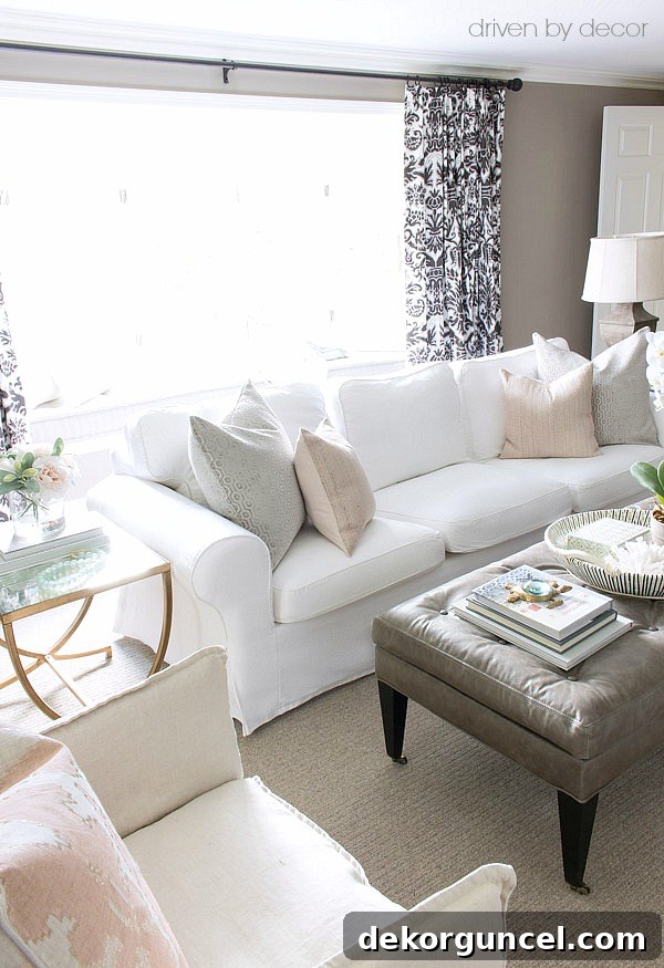 IKEA Ektorp sofa with gray and soft blush pillows