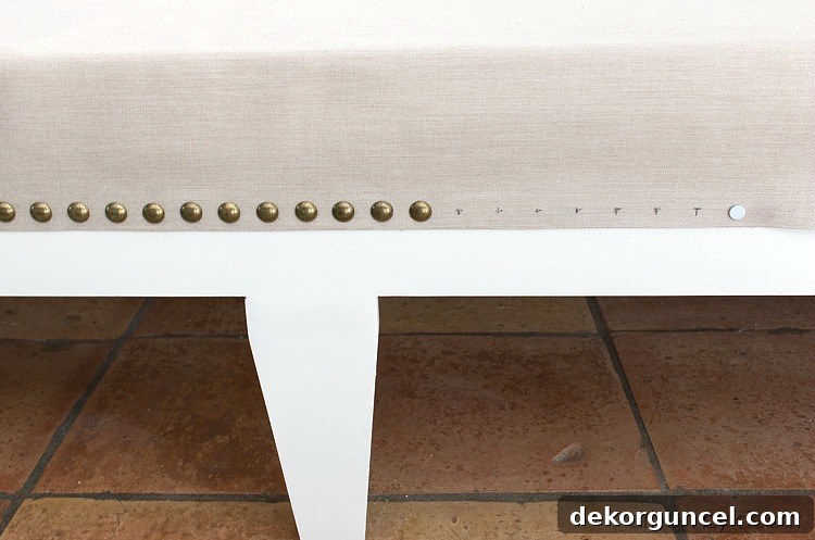 Build Your Own Banquette Seating 13 Achieving a perfectly straight nailhead trim line on a kitchen bench.