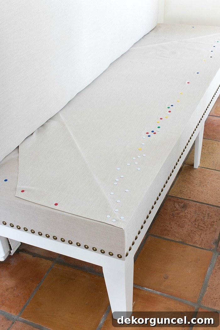 Build Your Own Banquette Seating 14 Detail of brass nailheads and fabric corner treatment on kitchen bench seat.