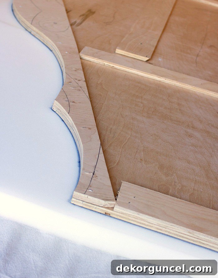 Build Your Own Banquette Seating 4 Trace headboard edges onto foam for accurate cutting to create a padded backrest.