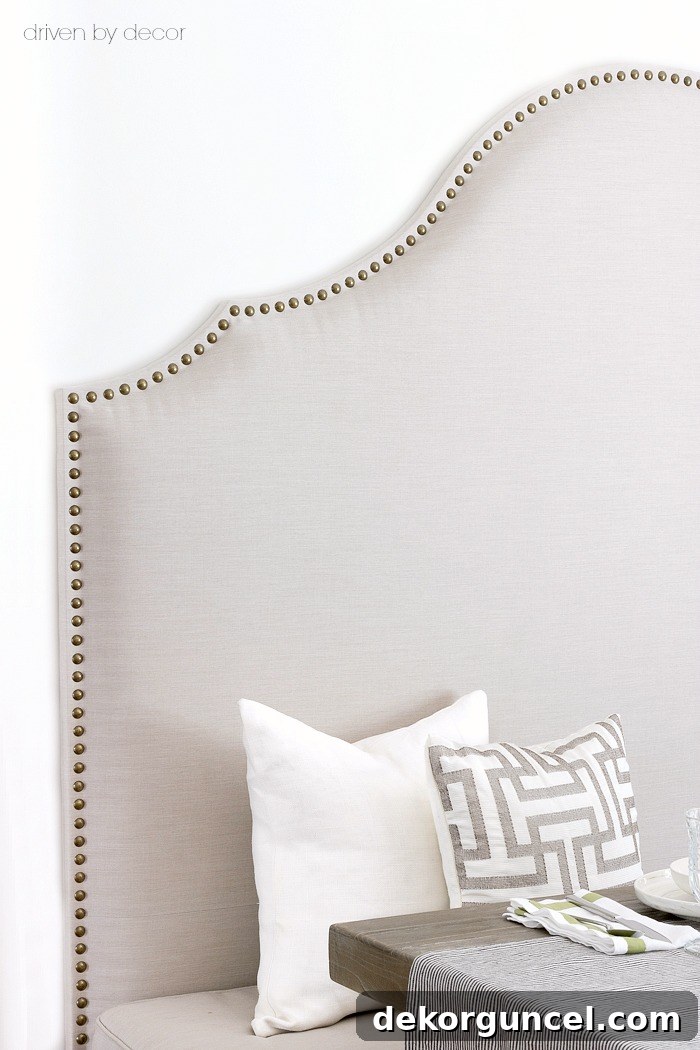 Build Your Own Banquette Seating 9 Trick for applying nailhead trim perfectly straight: pre-drilling pilot holes.