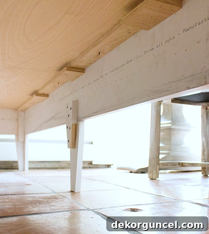 Build Your Own Banquette Seating 10 Detailed construction of the bench seat for a DIY kitchen banquette, showing frame, cleats, and leg attachments.