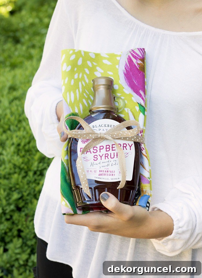 Simple Hostess Gifts That Impress 7 A delightful hostess gift idea: wrap a favorite gourmet treat in a charming tea towel for a thoughtful and appealing presentation.