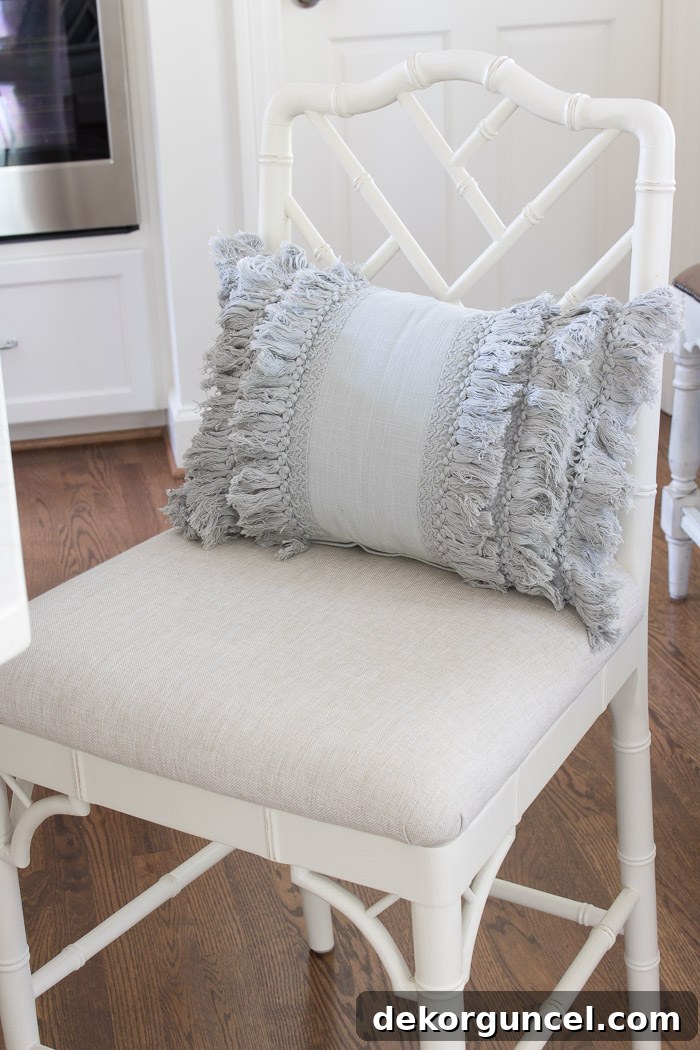 Gray layered fringe lumbar pillow - an adorable and stylish home decor accent!