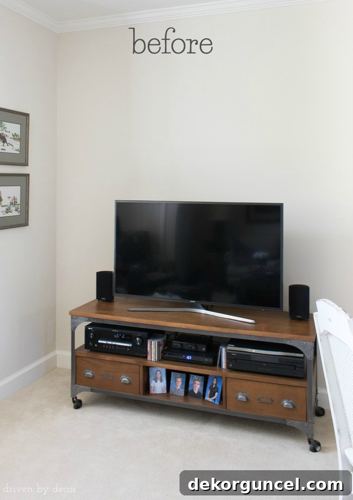 Above TV Shelf: Smart Storage, Seamless Style 6 "Before" picture of the empty space above a TV and media console, illustrating the blank wall before decoration.