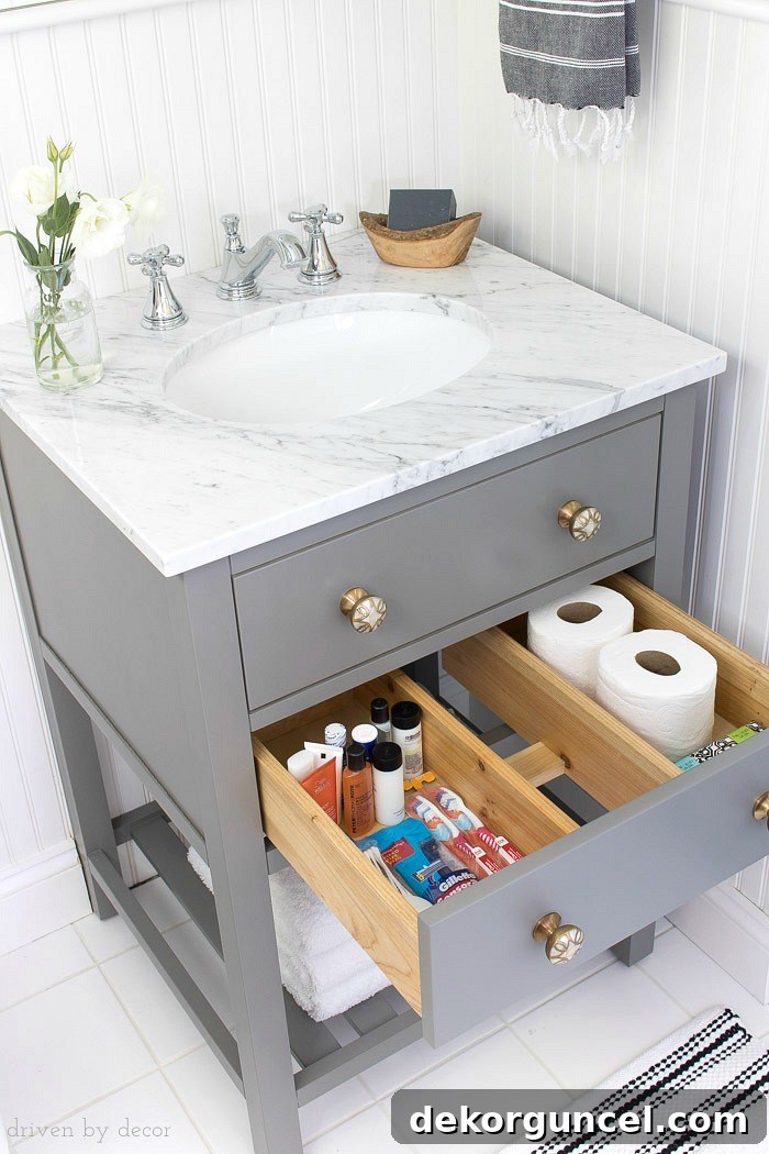 A pull-out storage drawer in this small vanity is perfect for storing toiletries and extra rolls of TP!