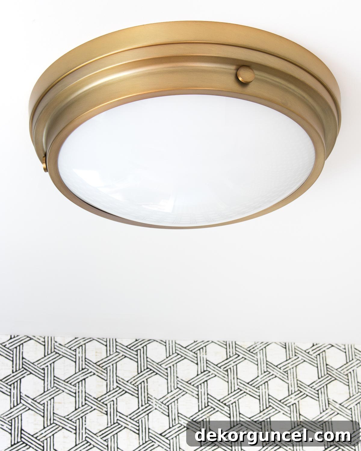 Brass flush mount ceiling light in our guest bathroom