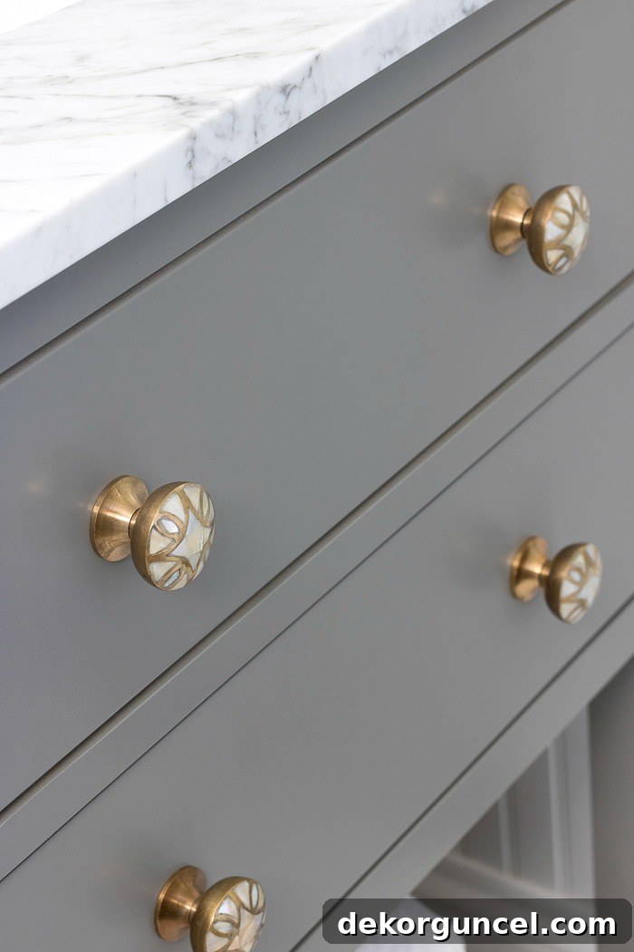 A great way to dress up a bathroom vanity is by simply switching out the knobs! Love these brass and mother of pearl beauties!