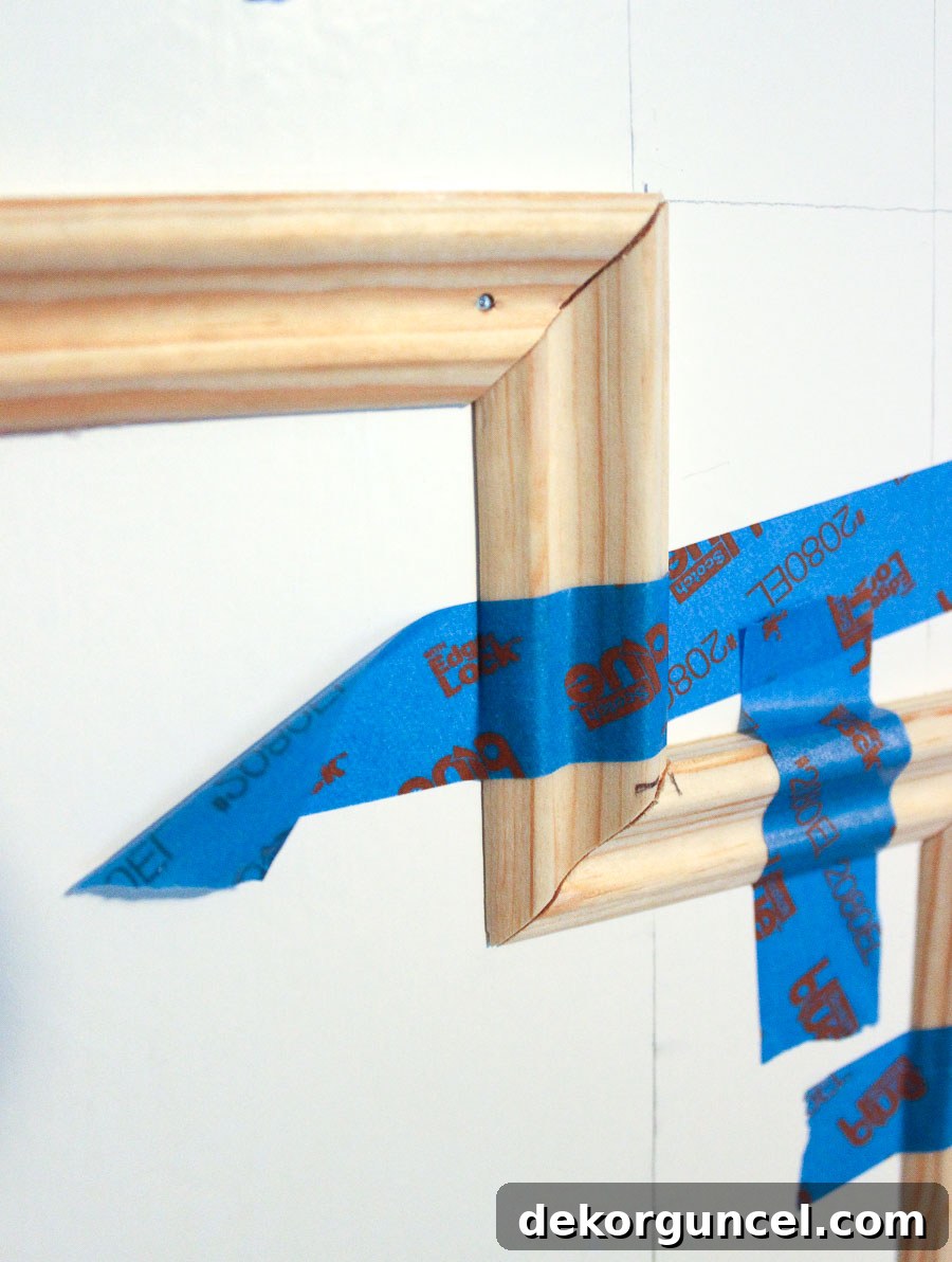 DIY Flat Panel Door Upgrade Guide 9 Nailing molding onto flat doors - love how this turned out!
