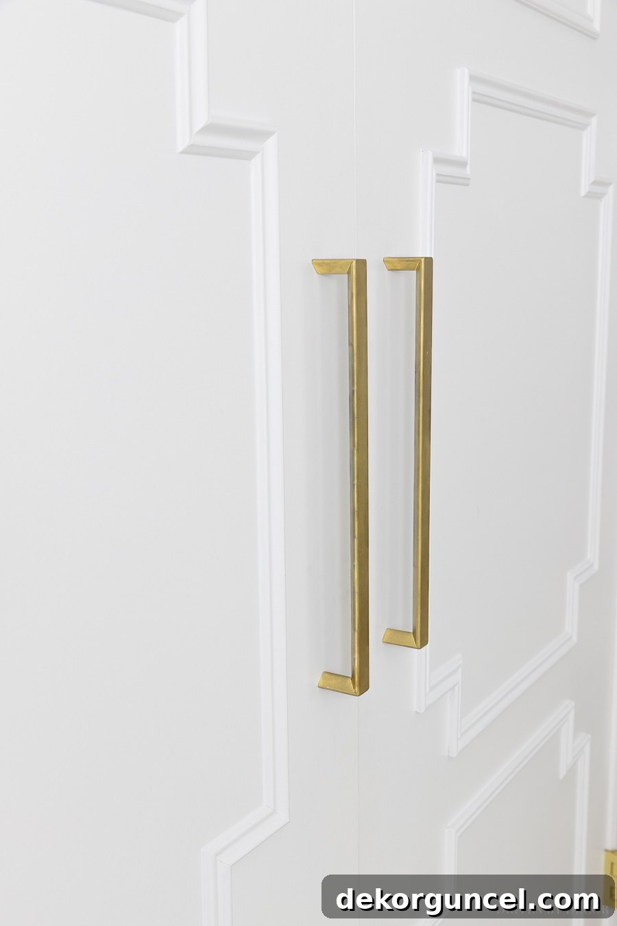 DIY Flat Panel Door Upgrade Guide 10 Long gold pulls dress up these closet doors - love this flat door makeover!