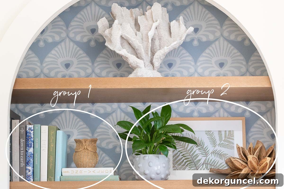 Essential tip for how to decorate a bookshelf effectively, illustrating two distinct groups of accessories for visual balance and interest.