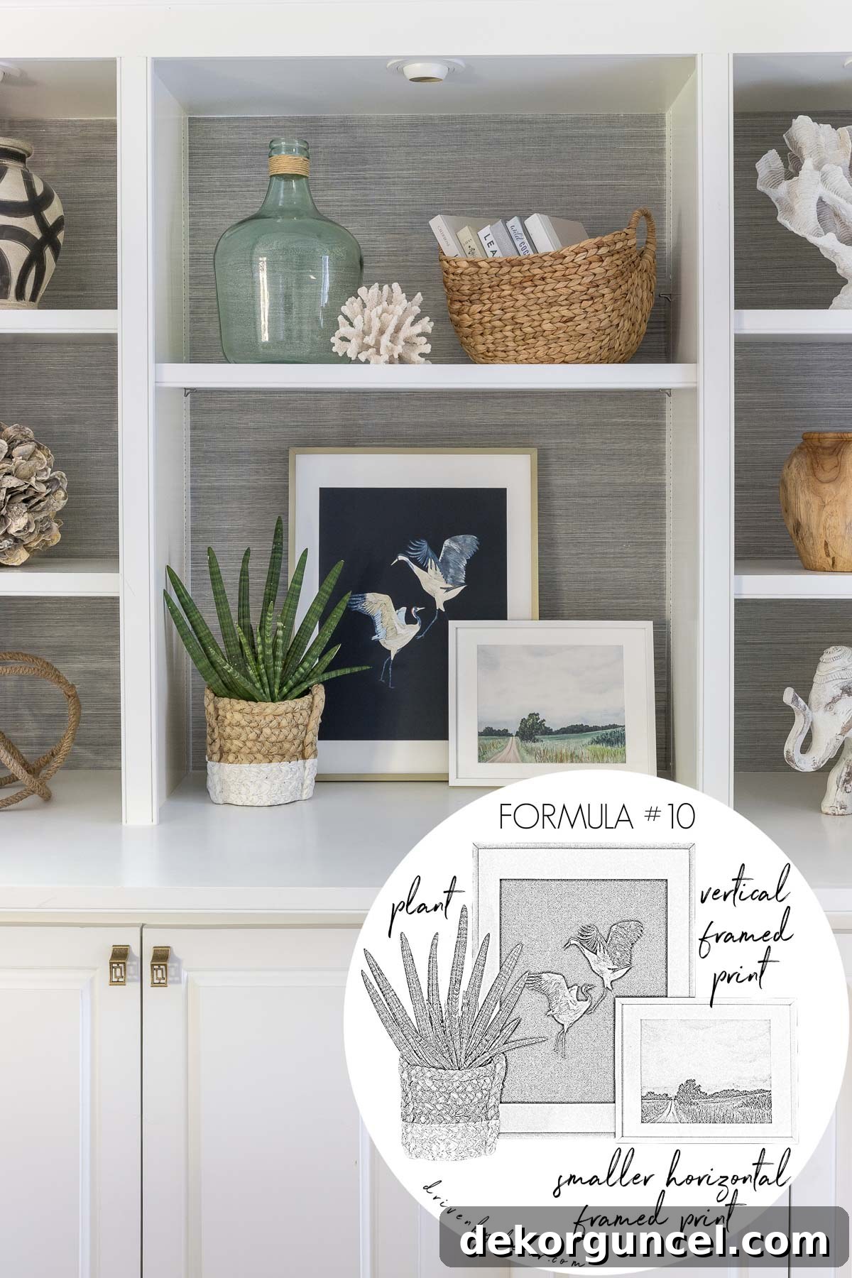 Layered framed art prints gracefully paired with a lush plant, expertly grouped to enhance and decorate a bookshelf.