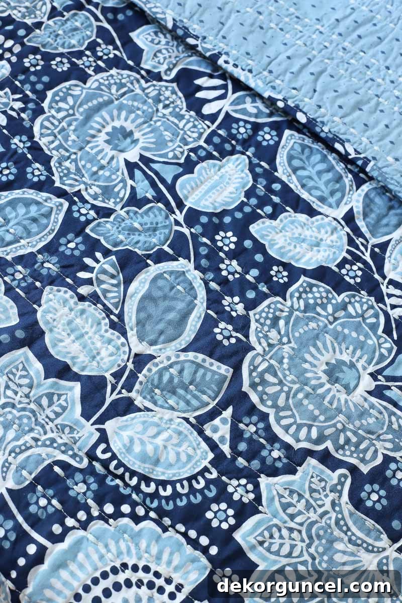 The vibrant and charming Vera Bradley Traveler Floral quilt, a perfect starting point for a bedroom design, featuring beautiful colors and a reversible pattern.