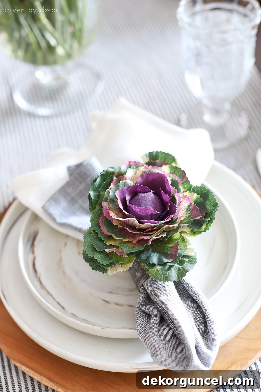 Faux kale step tucked into a napkin ring - a simple, perfect placesetting for fall or Thanksgiving!