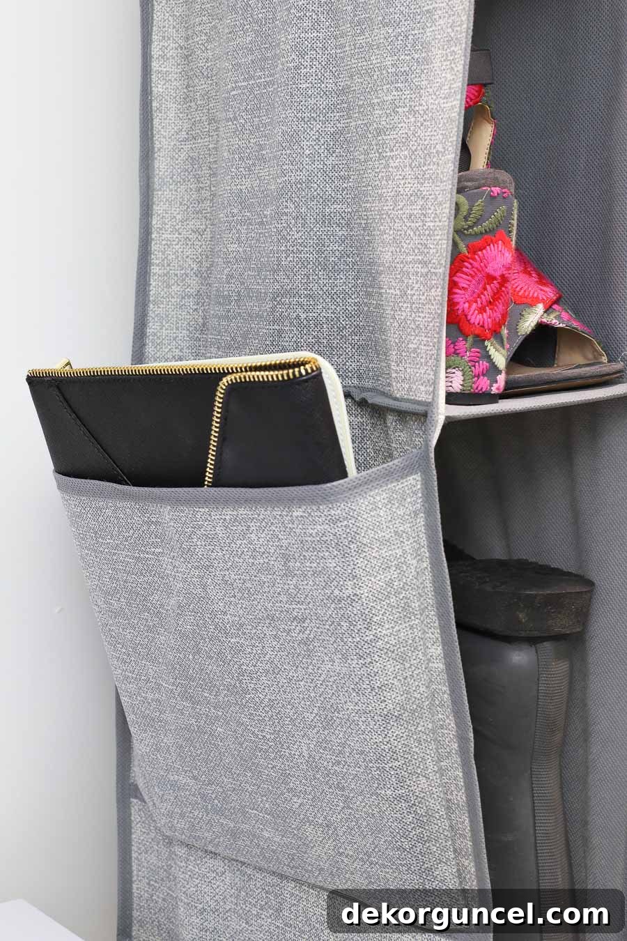 Storage pocket on the side of a hanging shoe and boot organizer - smart organization idea!