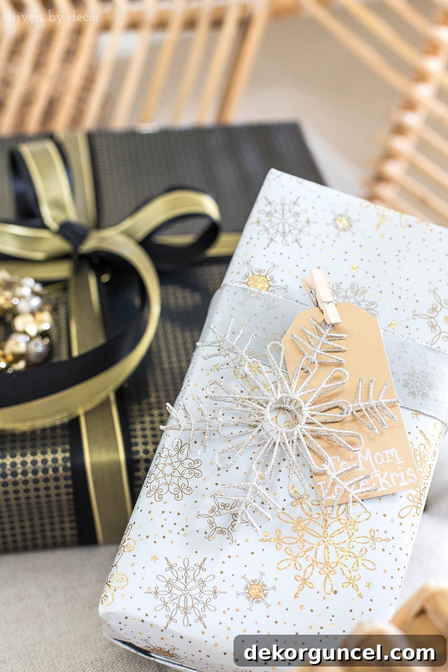 Attach metallic gift tags and glitter snowflakes to Christmas presents using cute mini clothespins for a unique touch.