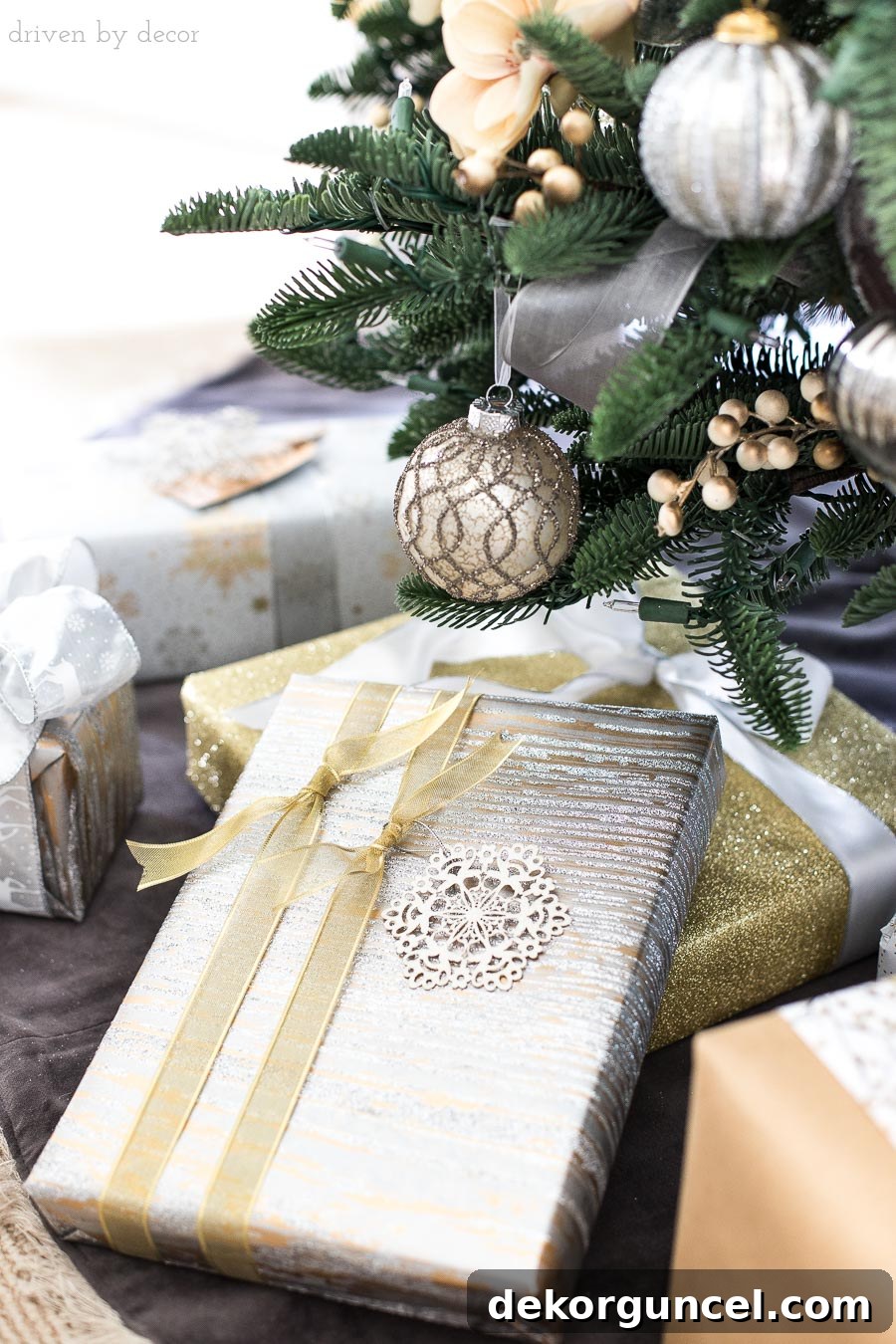Tie two parallel ribbons lengthwise around rectangular Christmas presents with staggered knots for an elegant, unique look.