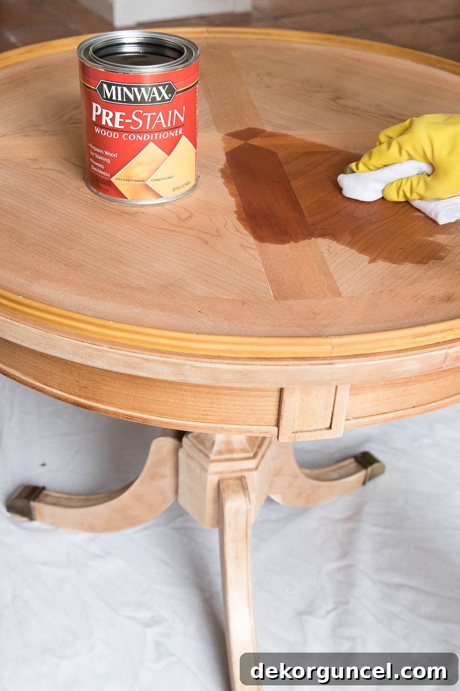 How to Refinish an End Table From Beat Up to Beautiful 7 Applying Minwax Pre-stain Conditioner to wood furniture for even stain absorption