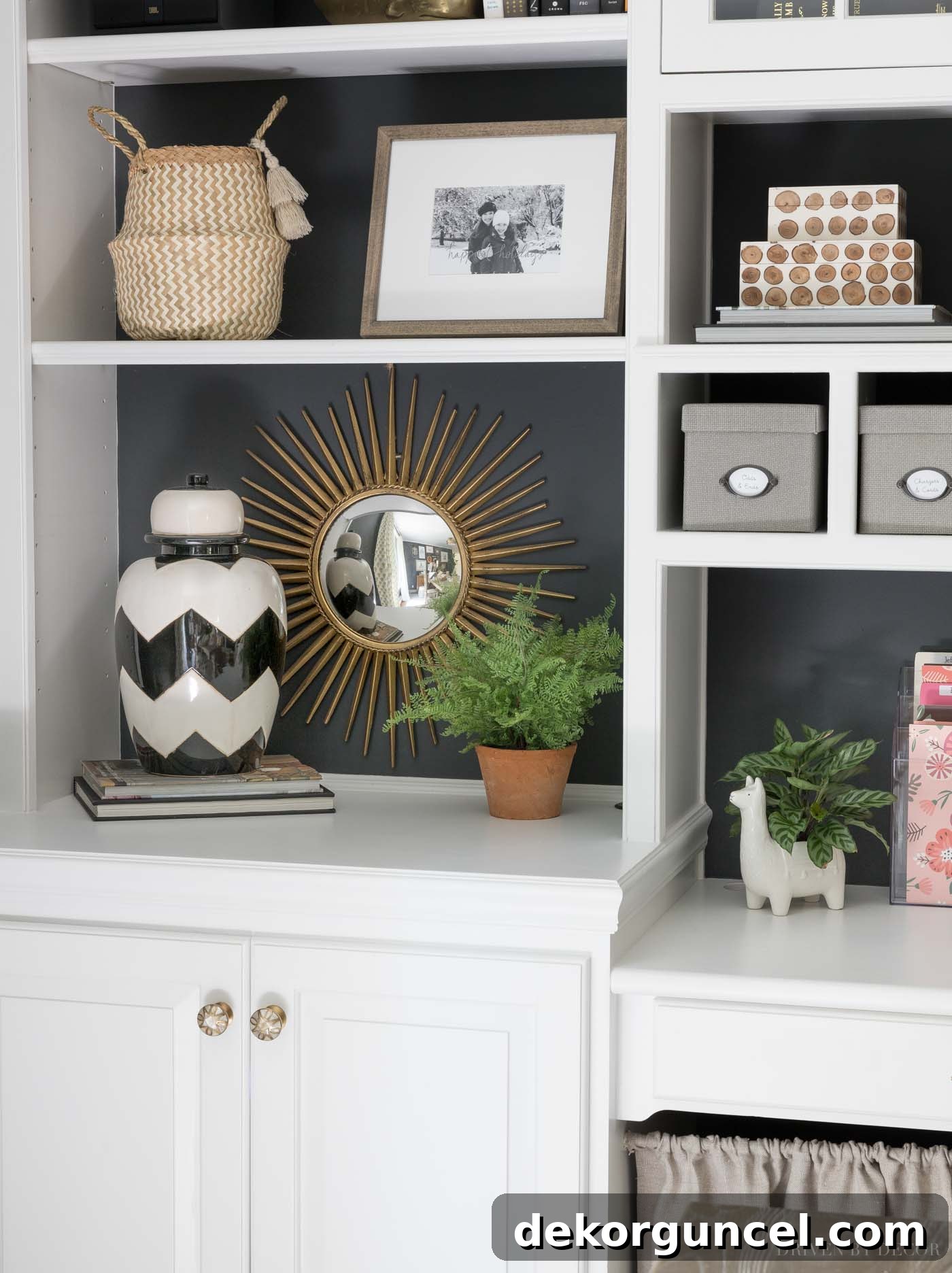 Love the starburst mirror she has on the back of her bookcase!
