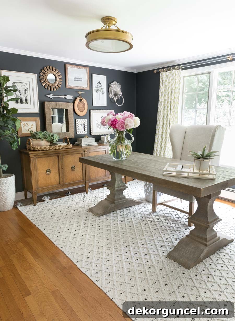 Love the small starburst mirror mixed in with art in this gallery wall!