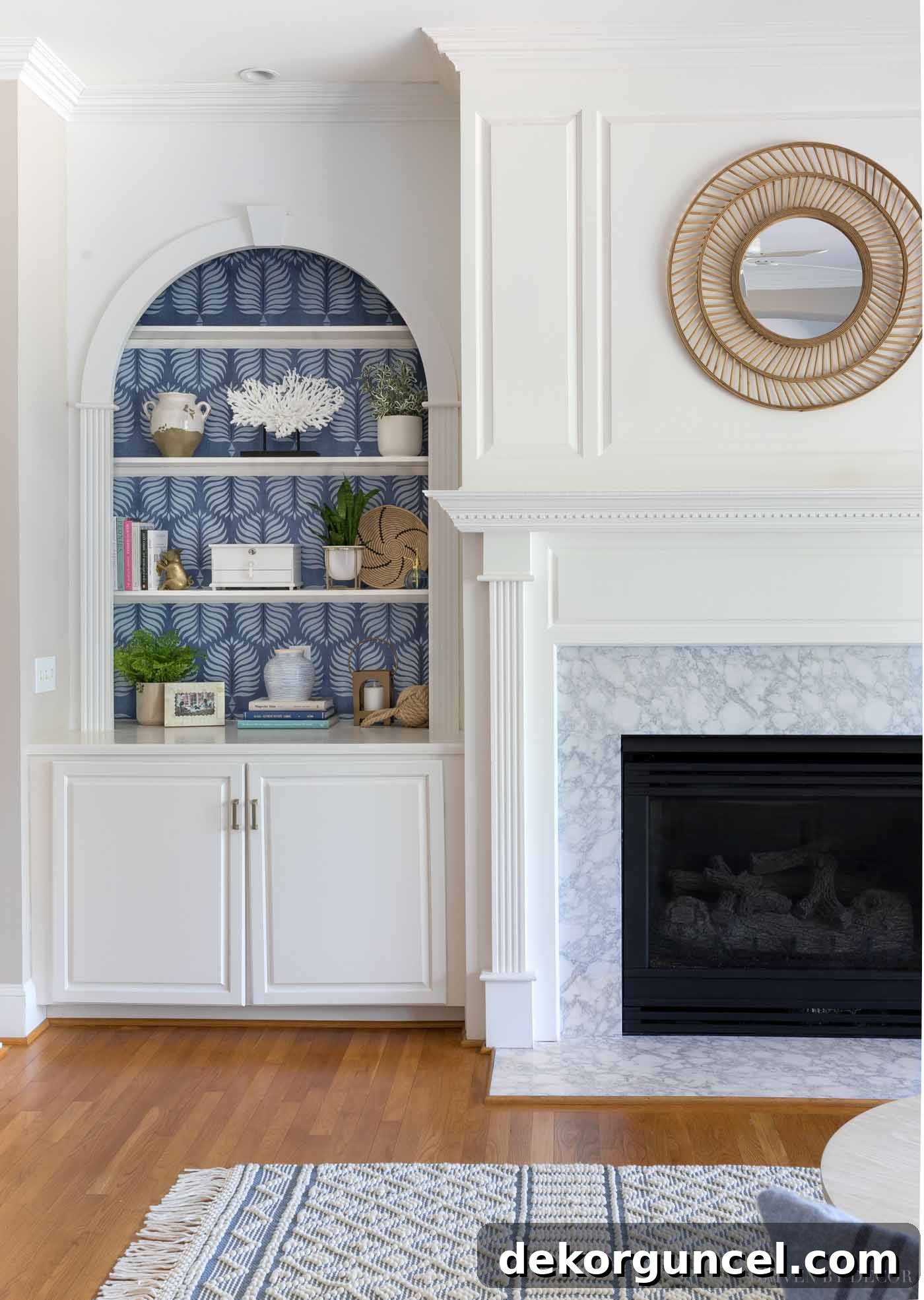 Love the look of a simple rattan mirror above the fireplace!