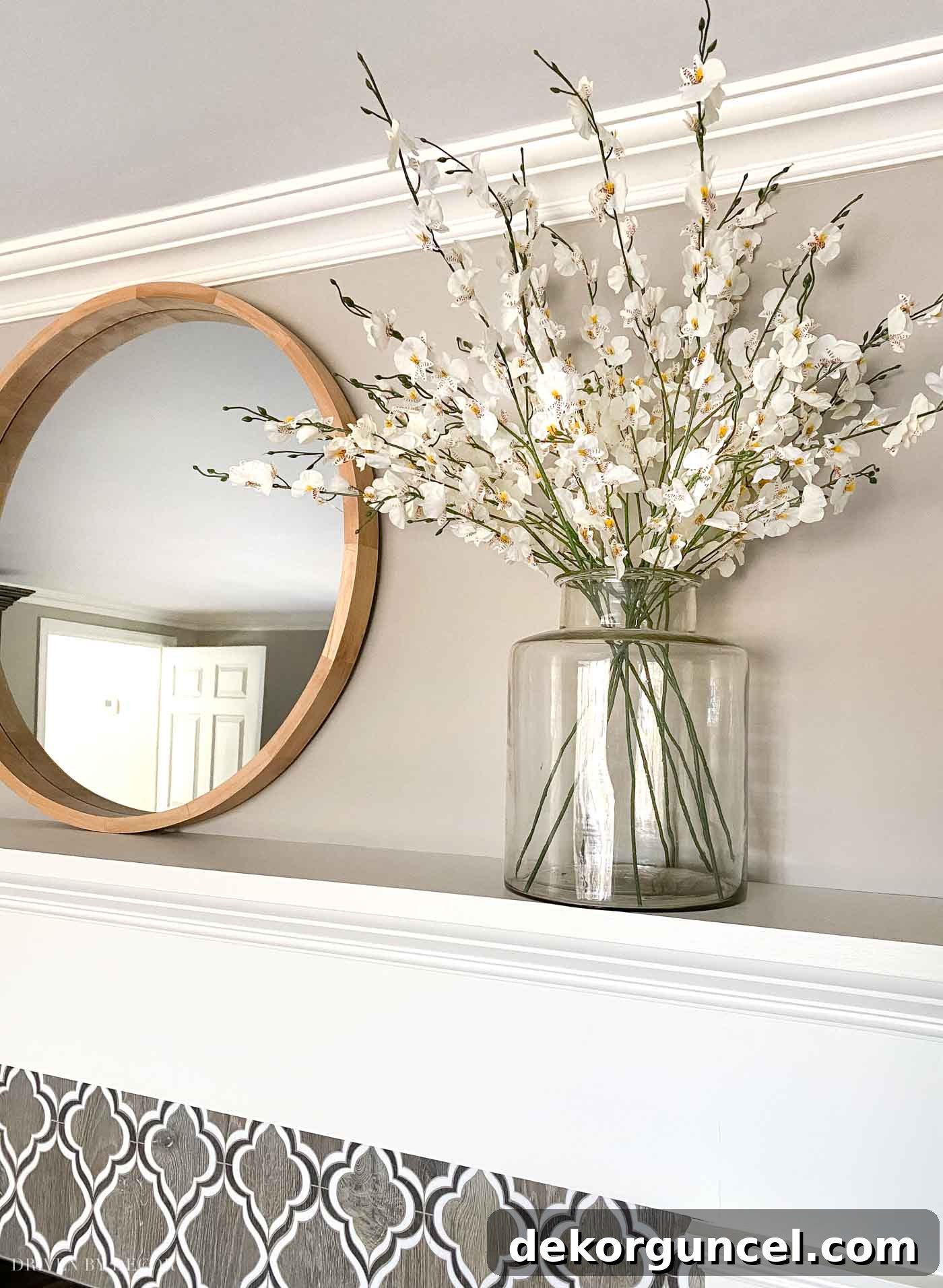 Love having a round mirror above the fireplace to reflect light around our room!