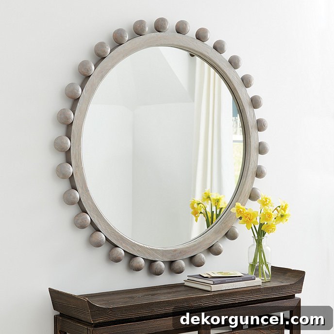 Statement-making round wood mirror - love the design and the graywash finish!