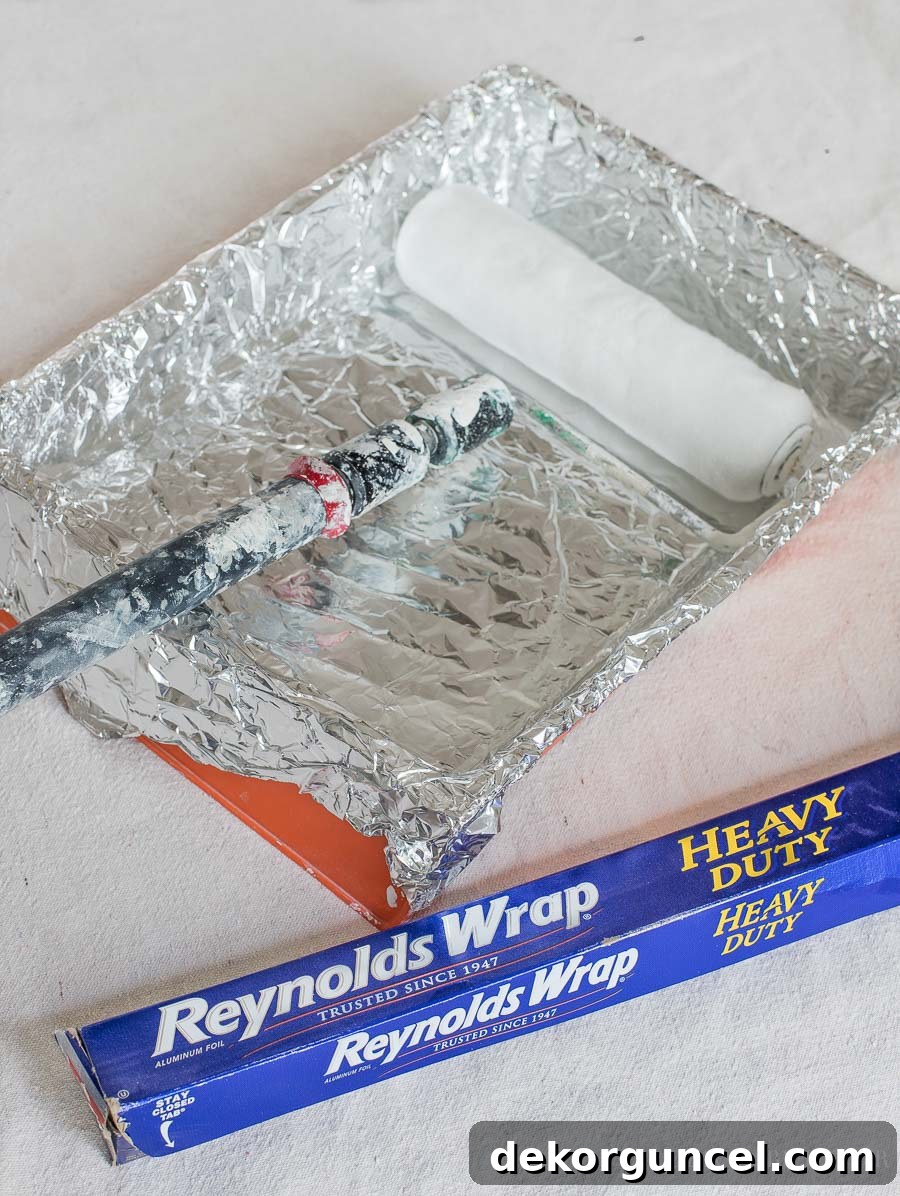 7 Speed Painting Secrets for a Flawless Finish 6 Why didn't I think of this?! So smart to use foil to line your roller tray. Definitely check out all of the other time-saving painting tips in this post!